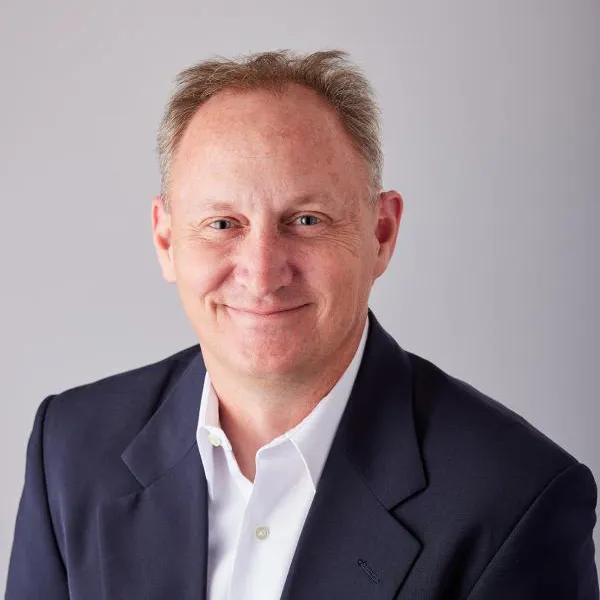 a photo of a man on a gray background