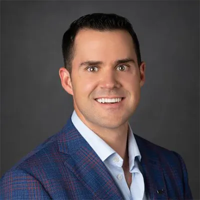 A photo of a man on a gray background