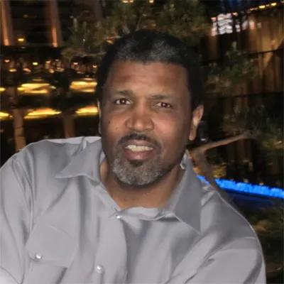 a man photographed inside of an event space