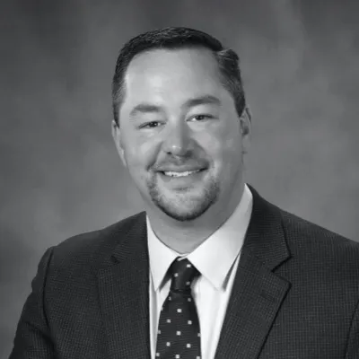 a black & white image of a man in a suit