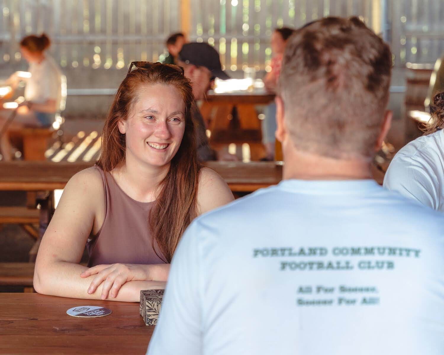 Jerika Ferguson talks to colleague at the Portland Community Football Club
