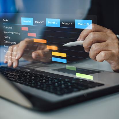 Person pointing at a five step plan above a laptop with a pencil