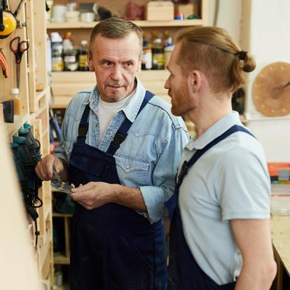 two people talking in a workshop
