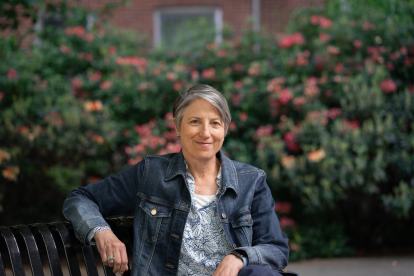 Andrea Marks sitting on a bench outside of Austin Hall