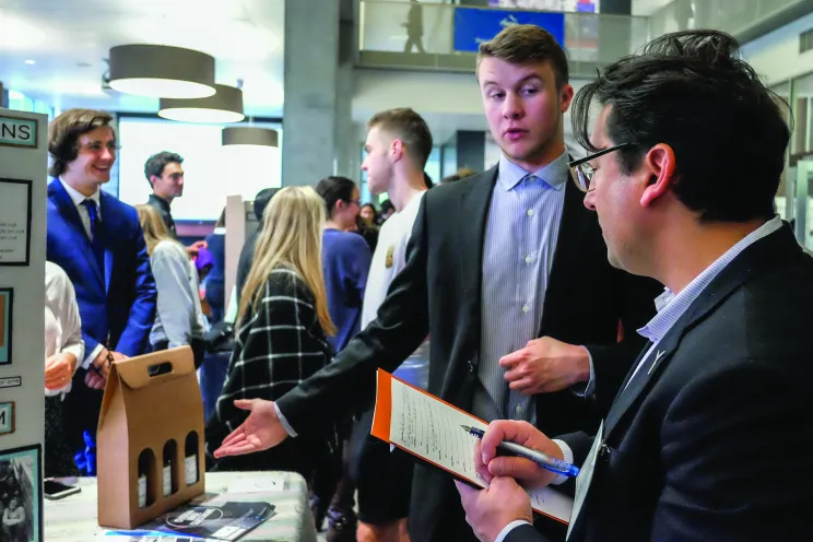 A person showing off a business project to another person